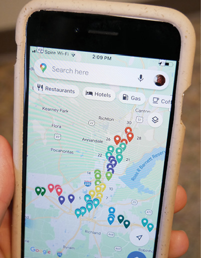 A closeup of a smartphone showing 42 pinned locations on a map of the Jackson Metro area.