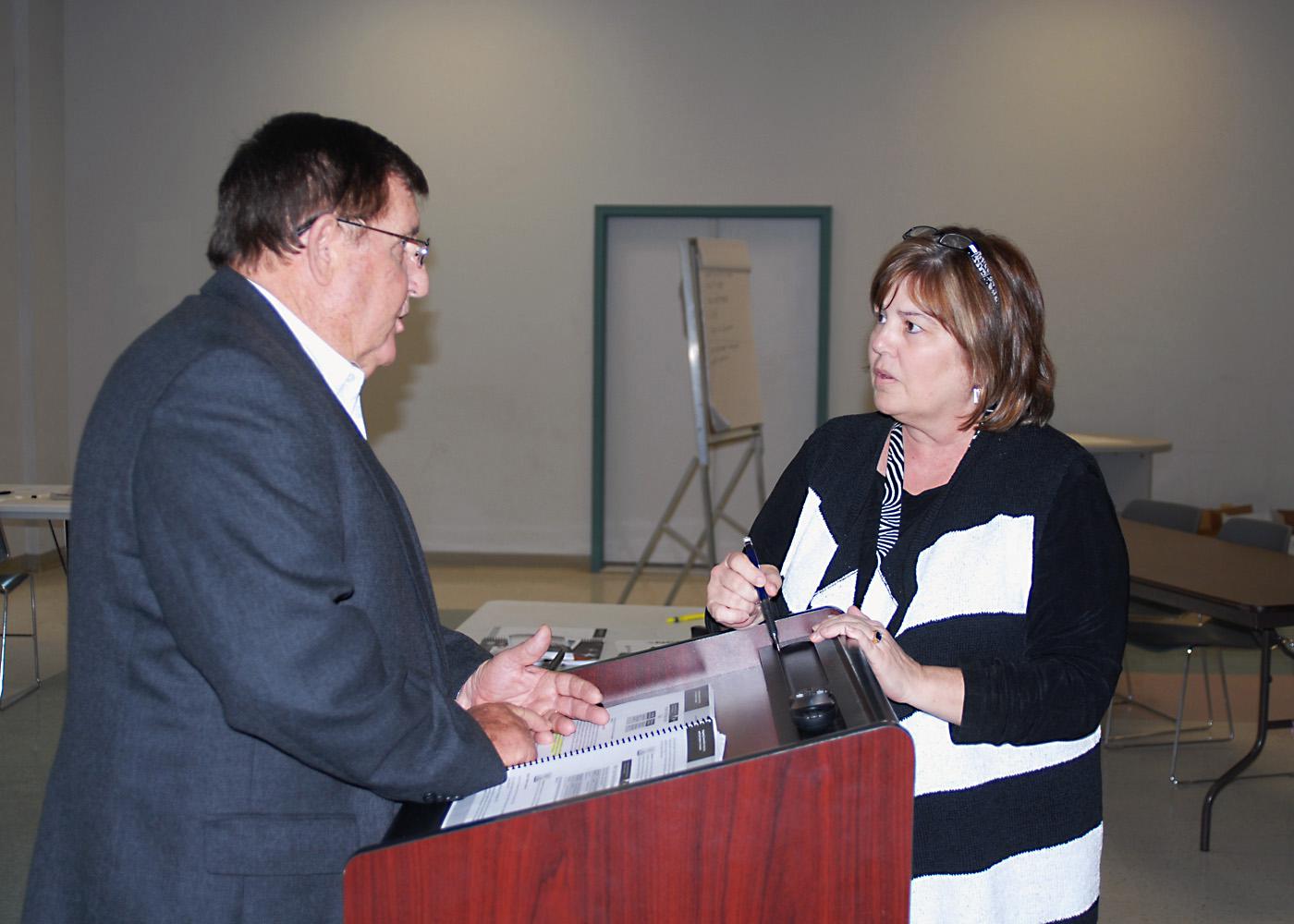 Billy Dictson, a trainer with the National Center for Biomedical Research and Training, and Queen Swayze, a food program specialist with the Mississippi Department of Health, discuss issues related to agricultural disasters. Mississippi State University's Extension Service organized the awareness training, held on Feb. 21, 2012, in Brandon to help first responders and others recognize the vulnerability of plants, animals and food supplies. (Photo by Linda Breazeale)