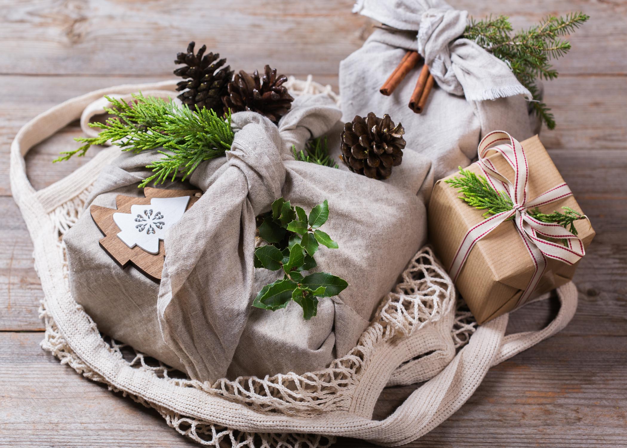 gifts wrapped in fabric scraps, recycled paper, raffia, and homemade embelishments