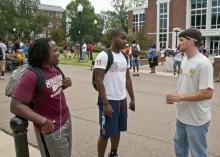 Michael Carlew (right), a senior studying landscape architecture and landscape contracting and management at Mississippi State University, talks to two other MSU students about the role landscape architects play in the environment. (Photo by MSU Ag Communications/Scott Corey)