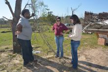 Clifton Haynes shares information about the structures and animals he lost on his farm near Louisville with Mississippi State University Extension Service disaster assessment team members Brandi Karisch (center) and Jane Parish, both of MSU's Department of Animal and Dairy Sciences. (Photo by MSU Ag Communications/Linda Breazeale)