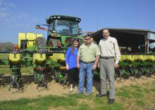 Molly and Brad Judson of Clay County are one of four couples who recently earned the National Outstanding Young Farmers award. They were nominated by Charlie Stokes, right, their Mississippi State University Extension Service agent, for the recognition from the National Association of County Agricultural Agents. (Photo by MSU Extension Service/Linda Breazeale)