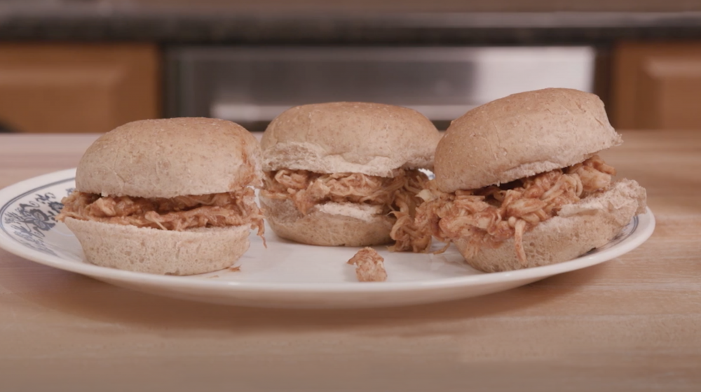 Barbecue sliders on a plate.