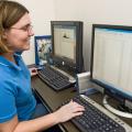 Fiona McCarthy, a biocuration specialist with the Mississippi State University College of Veterinary Medicine, examines protein expression data that may indicate how the immune system develops in chickens. (Photo by Tom Thompson)