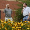 MSU landscape architectural professor Robert Brzuszek, left, and ornamental horticulture professor Richard Harkess examine Black-eyed Susans, which can be a good choice for landscapers who desire to use native plants. (Photo by Kat Lawrence)