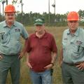 Jim Ed Owen, left, and Terry Owen, far right, of Wiggins, learned the craft of logging and the importance of stewardship from their father, Walt. The brothers have operated their own business for more than 11 years. (Photo bb Leighton Spann)