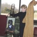 Columbus resident Terry Brewer unveils a portrait of her 15-year-old dog, Abby, that she commissioned in honor of faculty, students and staff at Mississippi State University's College of Veterinary Medicine. The portrait will hang in the Small Animal Clinic's reception area. (Photo by Tom Thompson)  