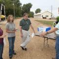 A Mississippi State University Extension Service team gets a				crash-course in how sprayers work from Dan Reynolds. From left, Jamie Varner, Kelli McCarter and				Randy Loper are writing an app that will help farmers properly calibrate sprayers. (Photo by MSU Ag Communications/Kat Lawrence)