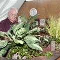 Joe Gordy visits the Mississippi State University campus frequently and has remained involved with his alma mater by serving on the MSU Foundation's board of directors. Here, the internationally renowned floral designer works with plants at MSU's Hunter Henry Center. (Photo by MSU Ag Communications/Kat Lawrence)