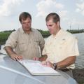 Jeremy Jack, left, and Mississippi State University professor Robbie Kroger discuss some of the conservation methods employed on the Silent Shade Planting Company in Belzoni. (Photo by MSU Ag Communications/Scott Corey)