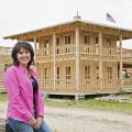 Jo Lynn Mitchell stops near the construction of Tiny Town, an addition to the agritourism venture at Mitchell Farms in Collins, Miss., on April 17, 2014. (Photo by MSU Ag Communications/Kat Lawrence)