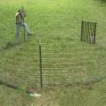 Bill Hamrick, a wildlife associate with the Mississippi State University Extension Service, constructs a corral trap, which wildlife biologists contend is the most effective method for reducing rapidly growing numbers of pigs. (Photo by MSU Ag Communications/Brian Utley)