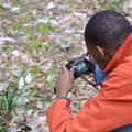 Kymari Young, a Mississippi State University Extension Service 4-H member from Simpson County, takes a close-up photo of daffodils March 8, 2015, in Natchez during a four-day photo safari. Eleven 4-H'ers from across the state visited historic sites from Leland to Natchez to improve their photography skills. (Photo by MSU Ag Communications/Susan Collins-Smith)