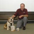 The Mississippi State University Cheese Store now sells peanuts to help promote consumption in the state. Pictured with two of the products are Bully, MSU's mascot, and Dr. Vance Watson, vice president for the Division of Agriculture, Forestry and Veterinary Medicine. Photo by Tom Thompson.