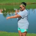 Erika Glenn of Starkville, Mississippi, does not neglect using sunscreen before exercising around Chadwick Lake on the Mississippi State University campus on June 26, 2017. (Photo by MSU Extension Service/Linda Breazeale)