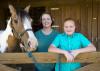 A young girl and her mother are pictured with their horse.