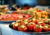 Trays of food are on a table.